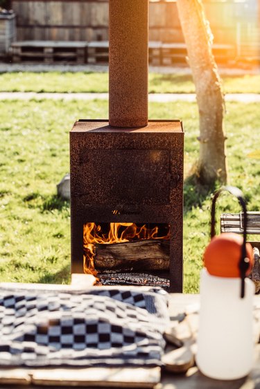 Pizza oven with fire at a garden party in summer.