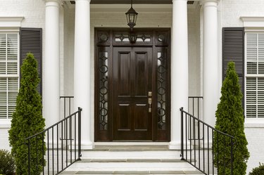 Dark front door with white columns