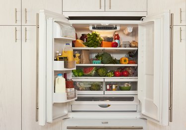 View inside refrigerator packed with healthy foods.