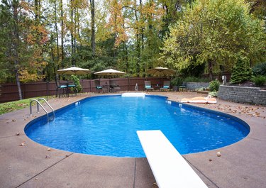 Inground residential swimming pool in Autumn