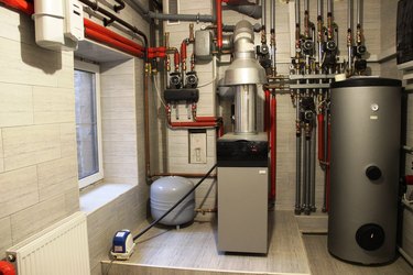 House boiler, water heater, expansion tank and other pipes. newmodern independent heating system in boiler room.