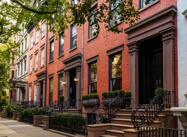Brownstone facades & row houses at sunset in an iconic neighborhood of Brooklyn Heights in New York City