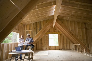 Construction Workers Discussing Plans