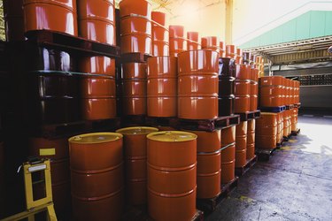 Red oil barrels chemical drums vertical stacked up