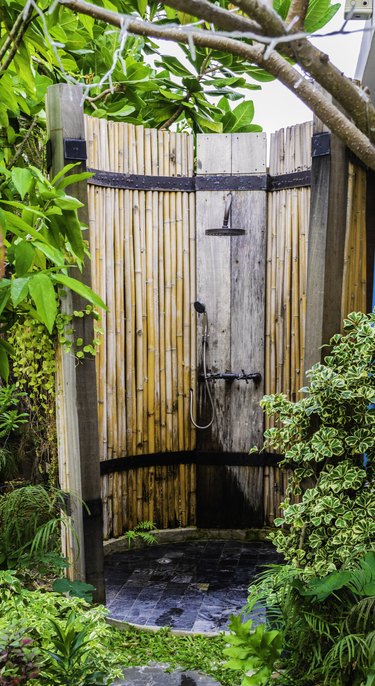 Outdoor shower in nature Bamboo wood surrounded.