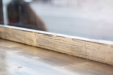 Wooden window sill and glass close up