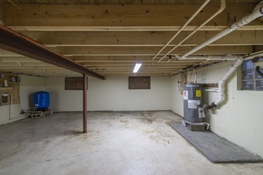 Basement with appliances in a residential house, empty, clean, and ready for sale.