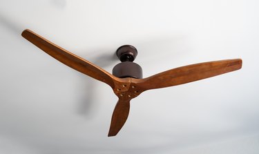 wooden ventilation fan on the white ceiling