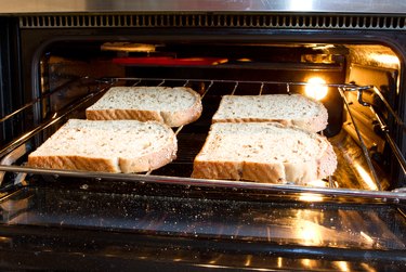 Making toast in an oven.