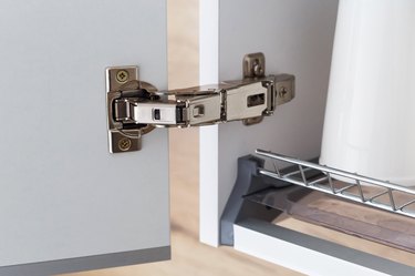 Door hinge of cabinet for drying dishes. Wide angle hinge.