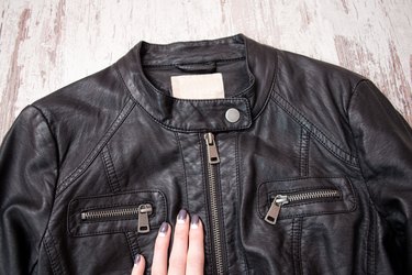 Black leather jacket with zipper.