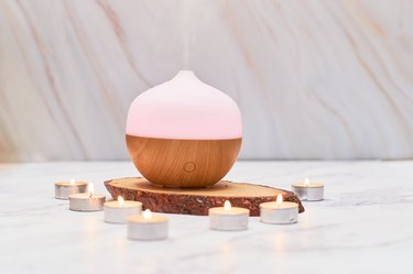 Aroma oil diffuser on table at home. Aromatherapy spa Concept