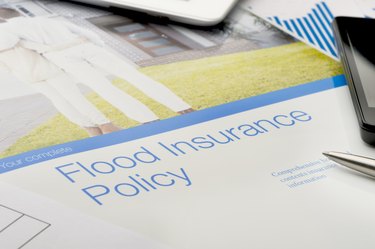 Flood insurance policy brochure with image of a couple