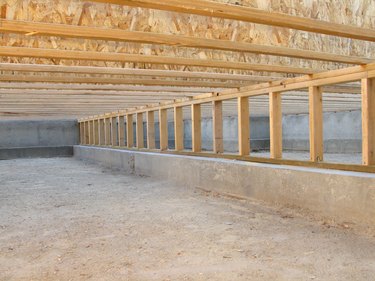Construction Site: Neat Clean Crawlspace, Floor Joists, and Pony Wall