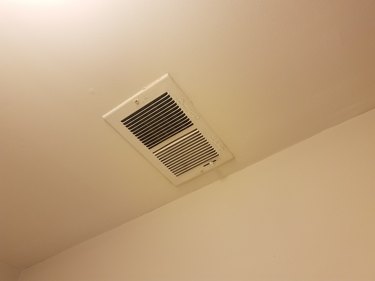 vent on the ceiling and white wall