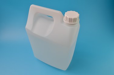 White gallon container isolated on a blue background