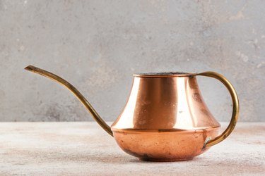 Old copper watering can.