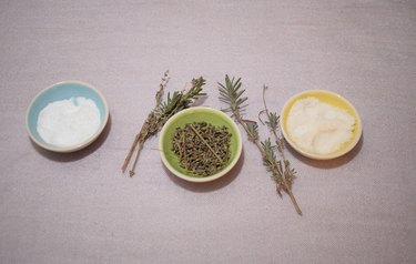essential oils and lavender on white background baking soda