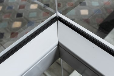 Corner joint of a window pvc frame with a rubber gasket or seal. Shot from inside.