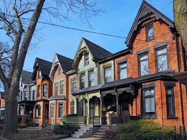 Row of old Victorian style brick houses with gables