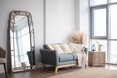 Stylish Scandinavian modern white cozy eco interior in minimalist style. Modern home decor.