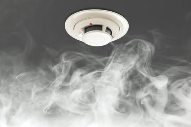 smoke detector on ceiling, fire alarm in action