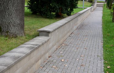 Concrete retaining wall blocks, low dividing wall of yard.