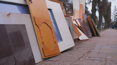 Pile of Old Furniture and Household Goods Dumped on the Street Sidewalk Prepared for Bulk Item Curbside Pickup Collection by City Services