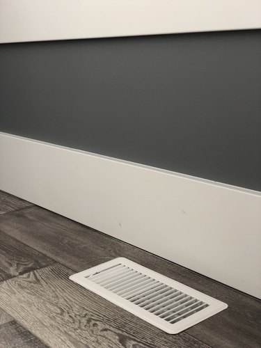 Floor vent next to floor boards