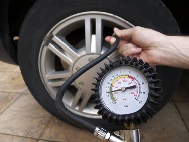 Checking tire pressure.