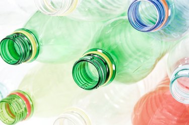 Green, red, and clear plastic bottles