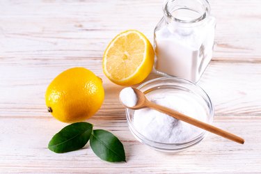 Natural products for eco friendly home cleaner, lemon, vinegar, baking soda.