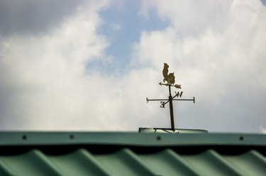 a weathercock on the top of the roof