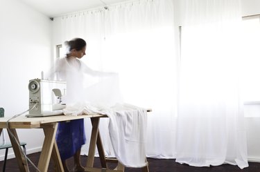 Woman making curtains