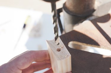 Drilling a hole into the cross brace