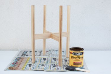 Applying stain to the plant stand
