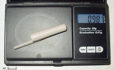 How to fix my digital pocket scale to read in hundredths of a gram