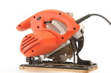 red circular saw on white background