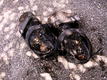 Wet sandals on a lava beach