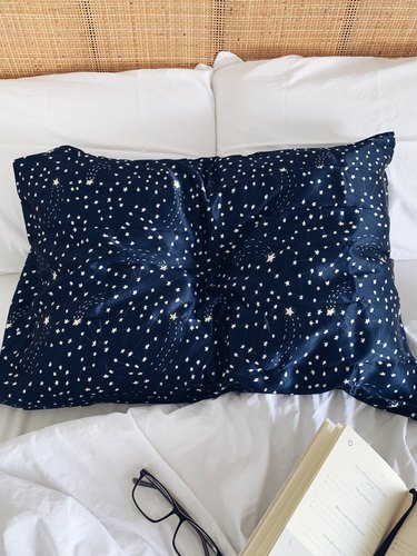 Brooklinen Mulberry Silk Pillowcase in Celestial on bed