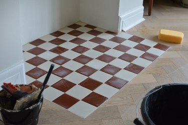 Finished red and white tiled fireplace hearth