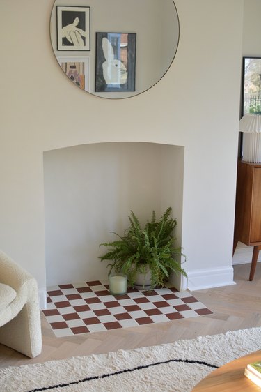 Red and white checkerboard tiles in fireplace hearth