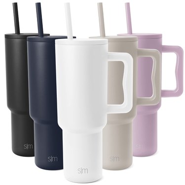 five tumbler mugs in different colors