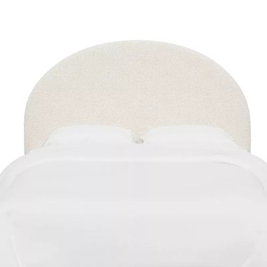 off-white arched upholstered headboard