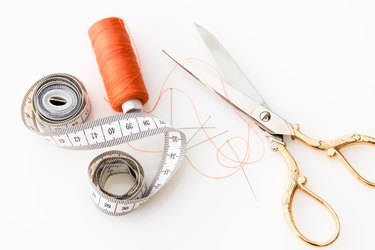 Sewing supplies on a white background