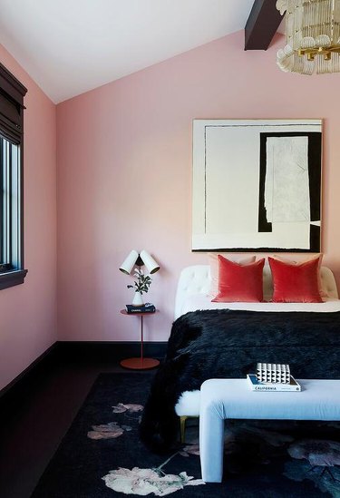 glam pink and black bedroom with black fur blanket