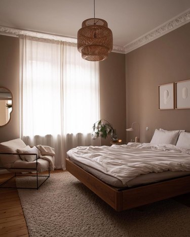 Light brown bedroom with boho pendant light
