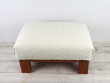 boucle ottoman with wood legs