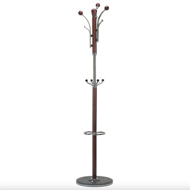 freestanding coat rack made of dark wood and silver metal, with wooden base and metal hooks at the top and center