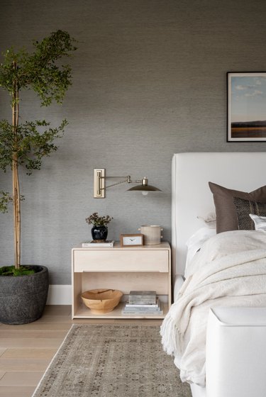 neutral-tone bedroom with gold bedroom lighting idea
